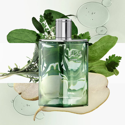 Green perfume bottle with silver cap on a white background with green leaves and bubbles