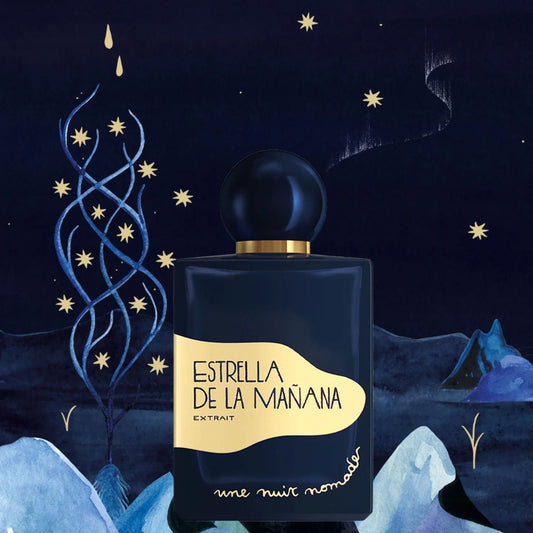 Perfume bottle labeled 'Estrella de la Mañana' against a night sky with stars and mountains.