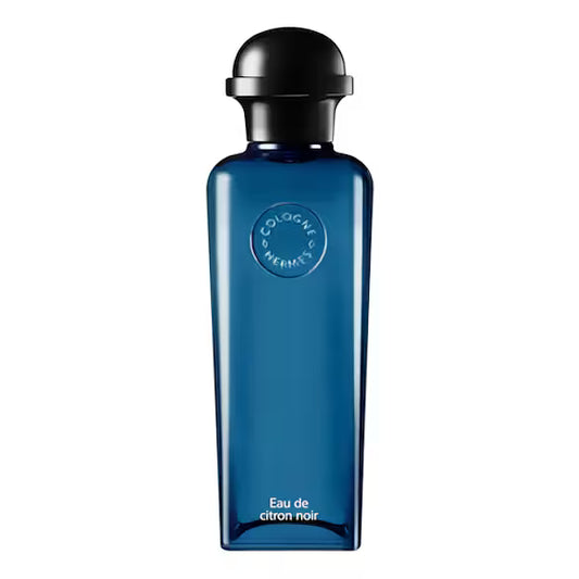 Blue cologne bottle with black cap on a white background