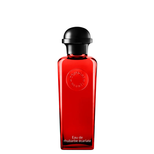 Red perfume bottle with black cap on a white background