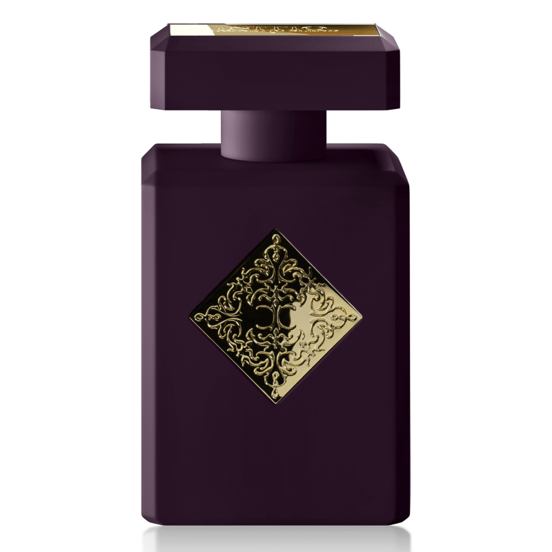 Purple perfume bottle with gold decorative label on a white background