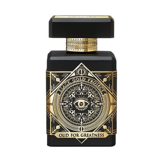 Black and gold perfume bottle with intricate design on a white background