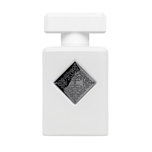 White perfume bottle with a decorative black label on a white background