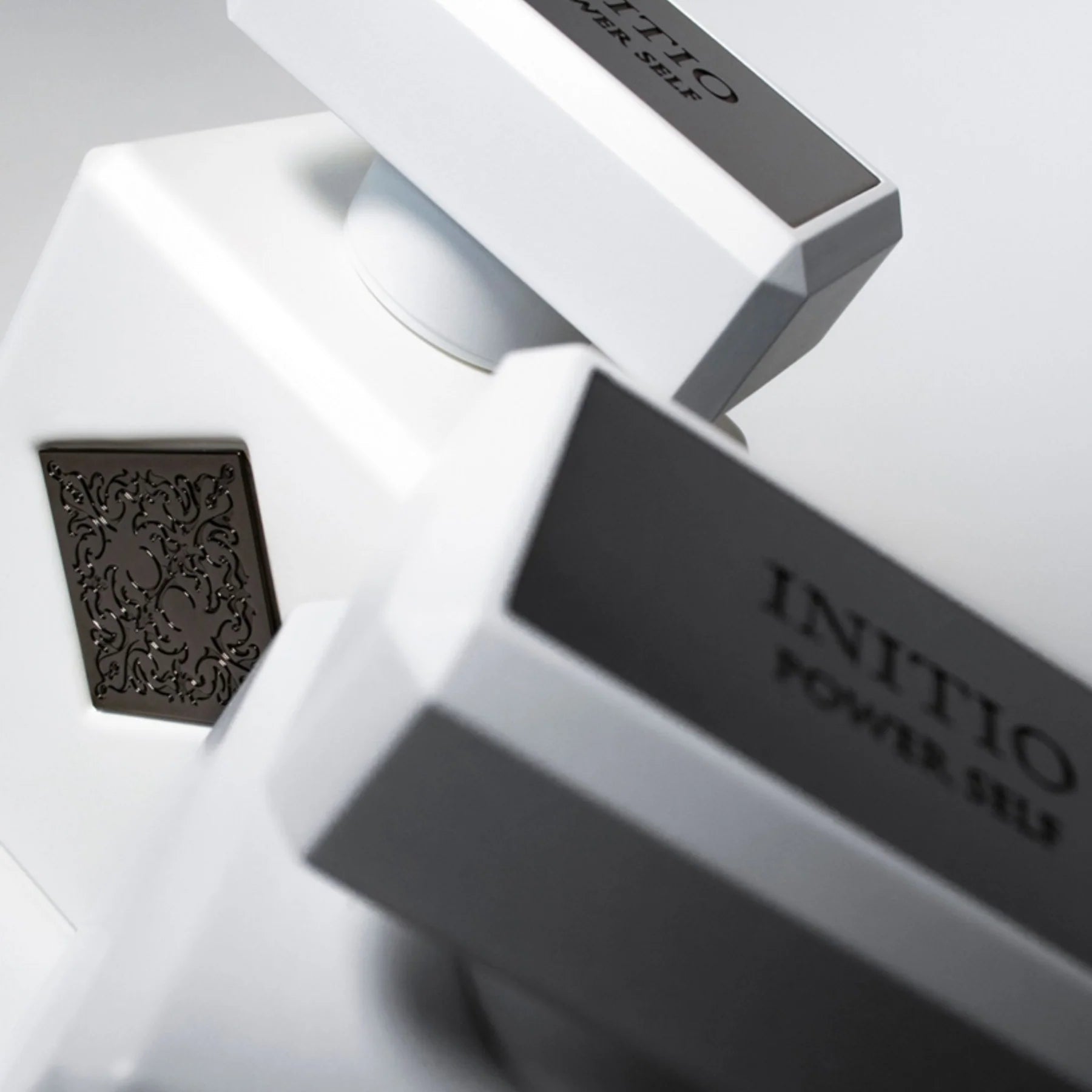 INITIO power self and its packaging on a light gray background