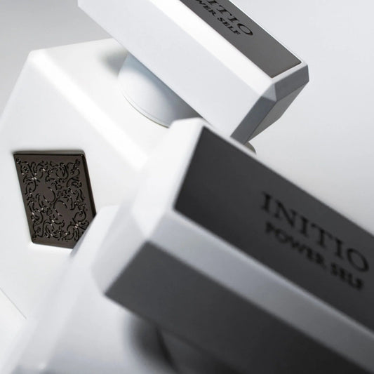 INITIO power self and its packaging on a light gray background