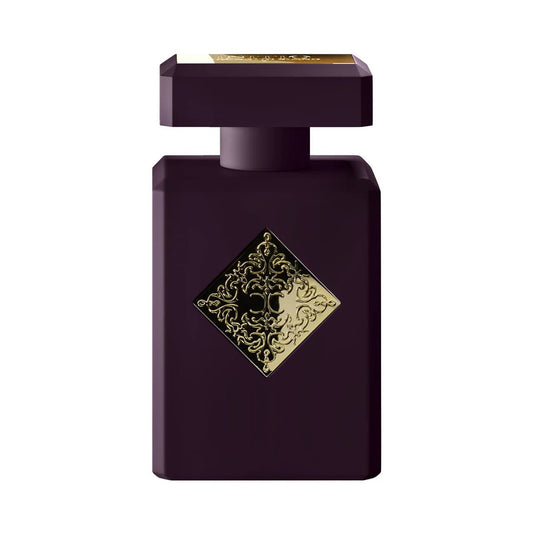 Purple perfume bottle with gold decorative label on a white background